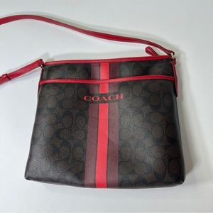 coach bag with red accents
